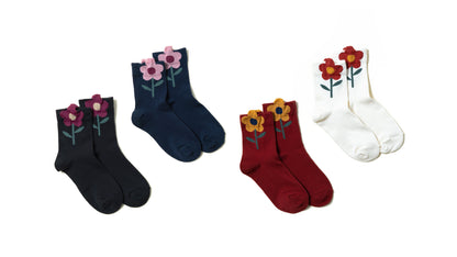 Assortment of stylish women's ankle socks with cute multi-colored flowers on the ankles