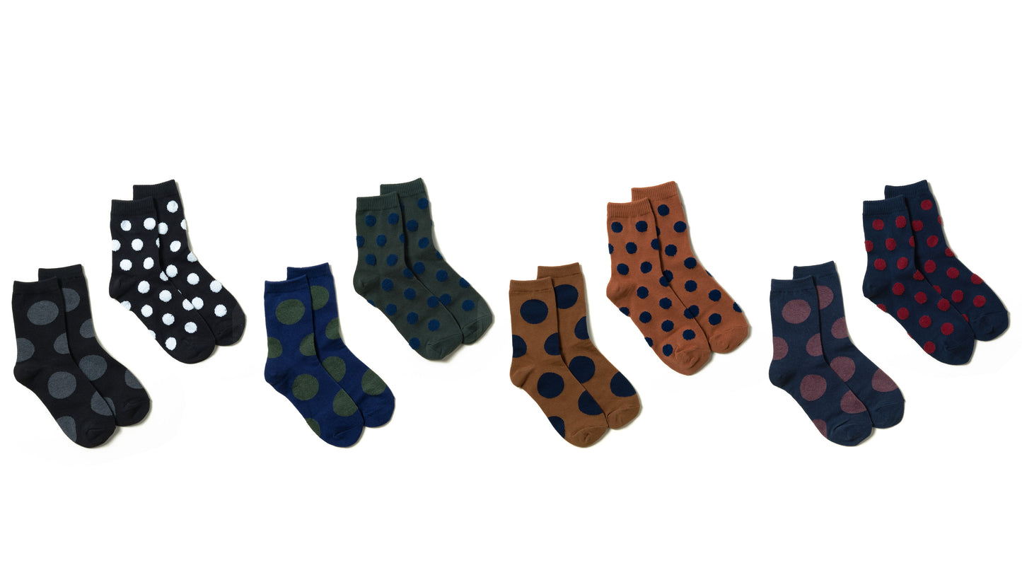 Assortment of women's ankle socks with various polka dot sizes and colors