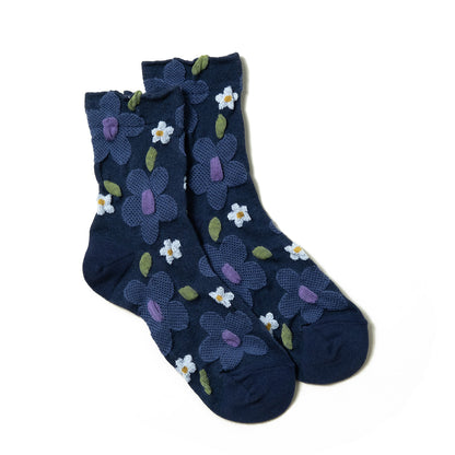 Luxurious navy blue women's socks featuring textured purple floral 