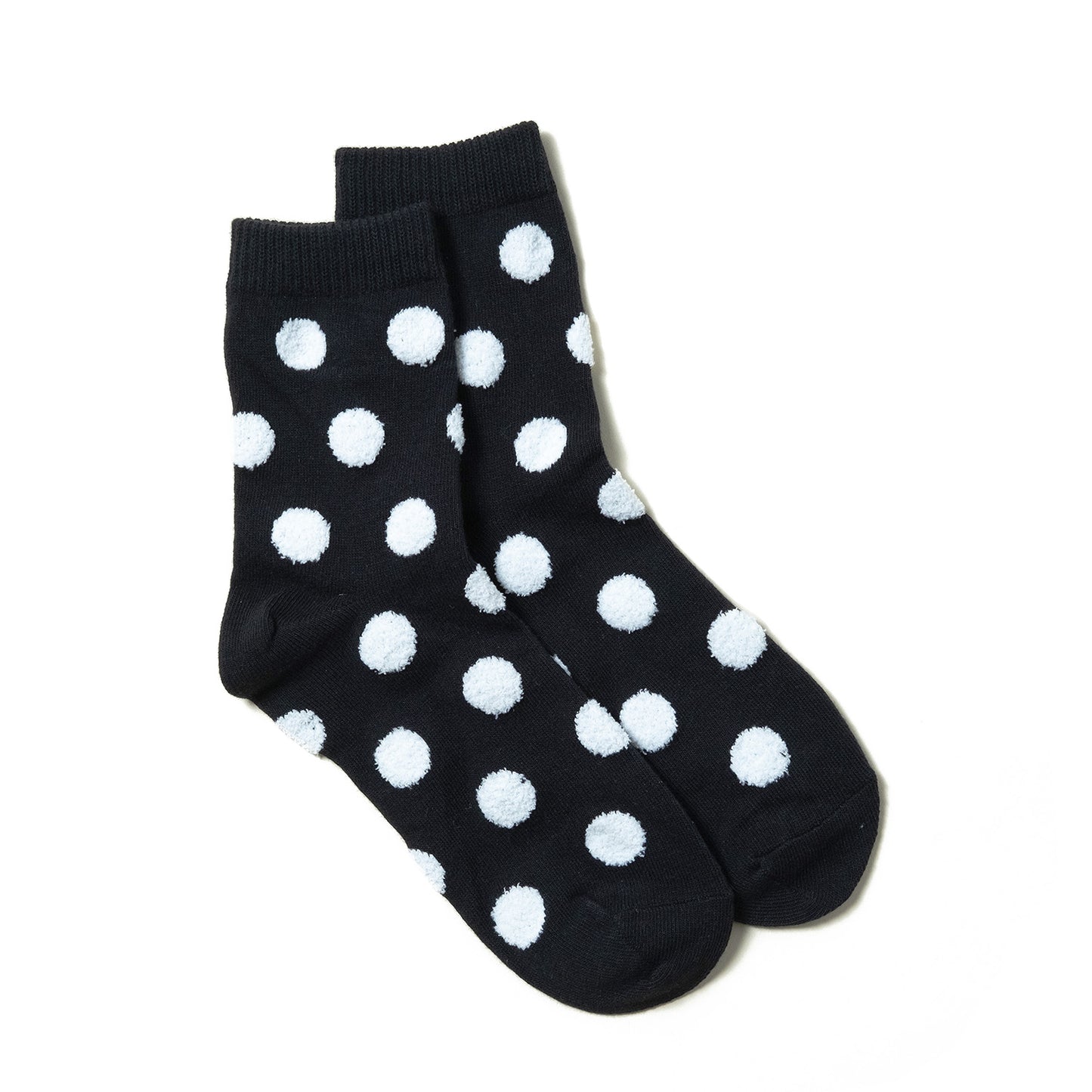 Soft and stylish black ankle socks with detailed white polka dots