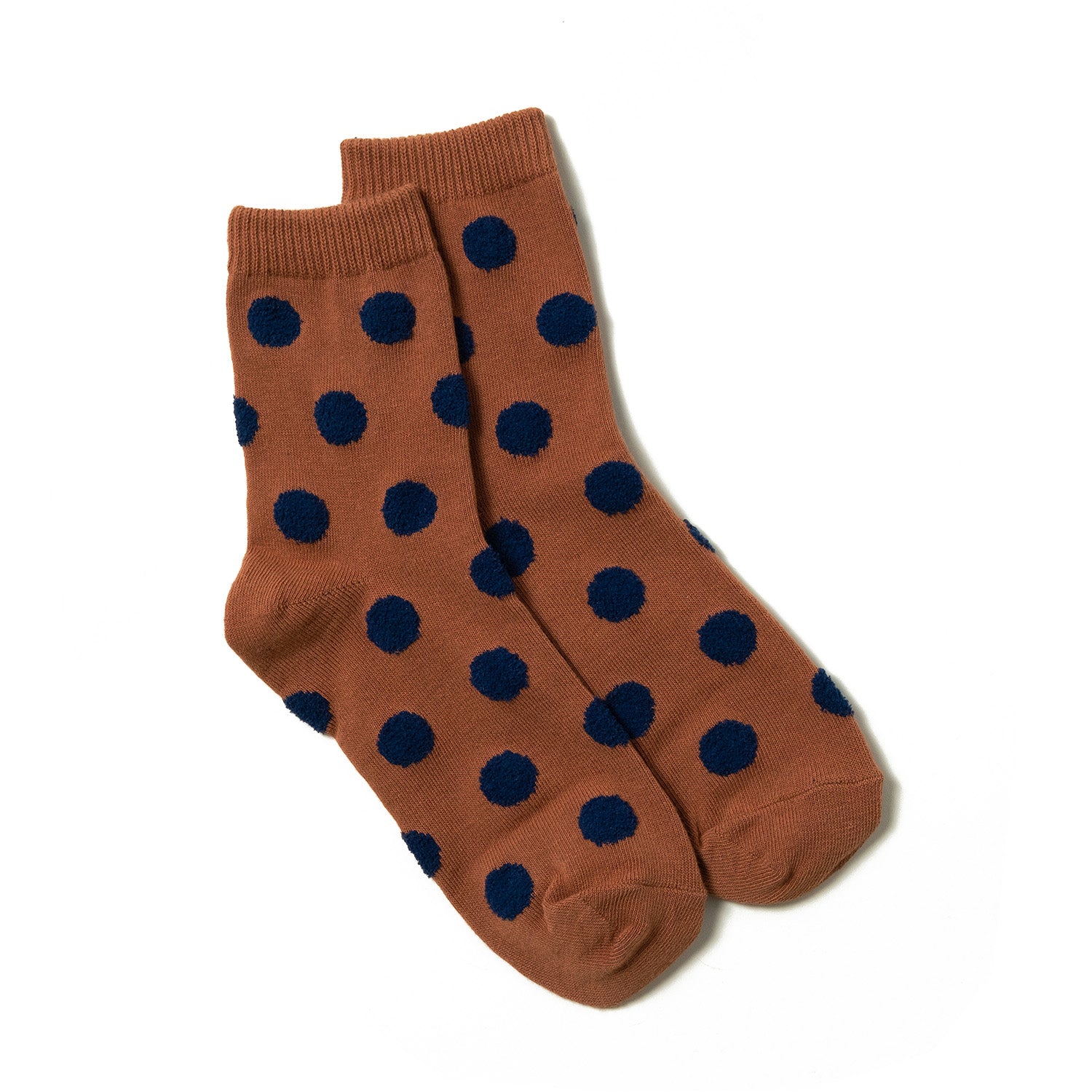 Soft and stylish orange brown ankle socks with detailed small navy polka dots