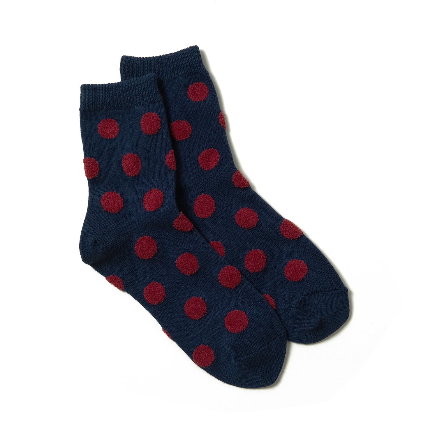 Soft and stylish navy ankle socks with detailed red polka dots