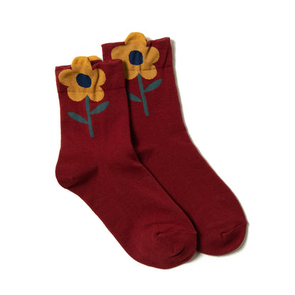 Playful red women's ankle socks with colorful yellow flower